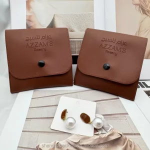 Elegant Waterproof PU Leather Button Gift Jewelry Packaging Pouch with Emboss Logo Small PU Vegan Leather Cosmetic Pouch
