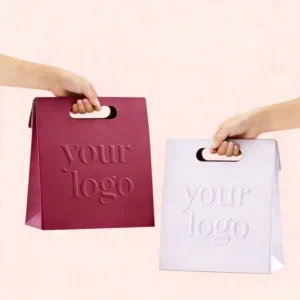 Luxury Embossed Logo Fashion Die Cut Handle Shopping Paper Bags Pink Die Cut Handle Makeup Paper Bags